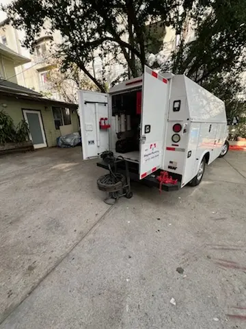 Magnet Plumbing service vehicle on-site for Grease Trap Cleaning in Park La Brea